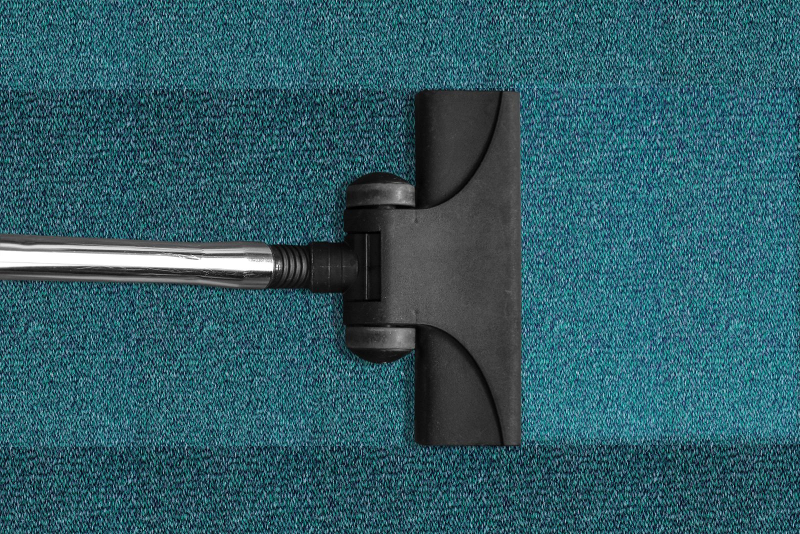 Vacuuming carpet during a condo cleaning in Mississauga