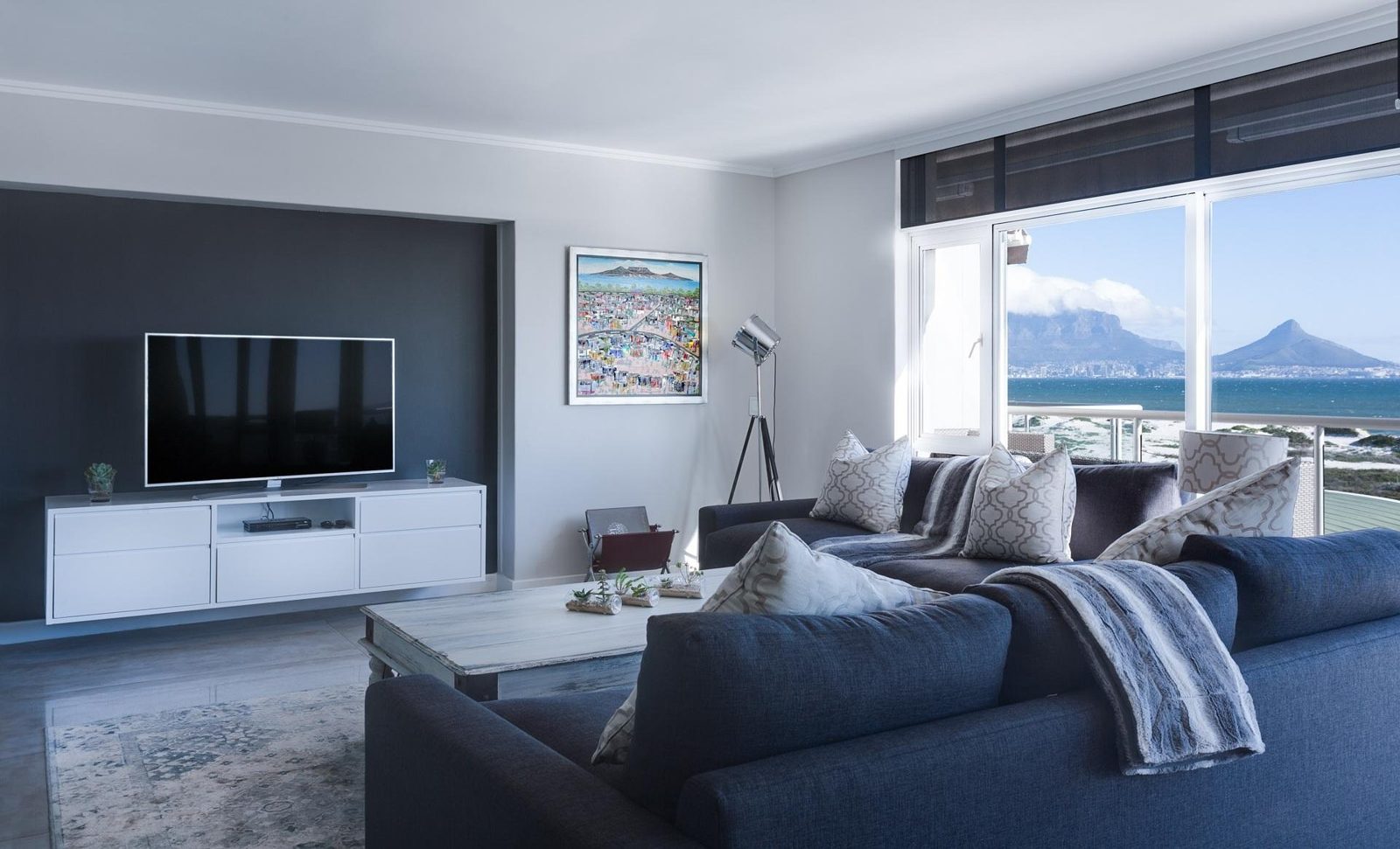 Clean, bright condo living room with a lake view in Toronto